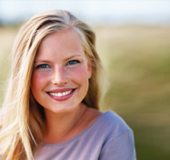 Attractive young female smiling outdoors